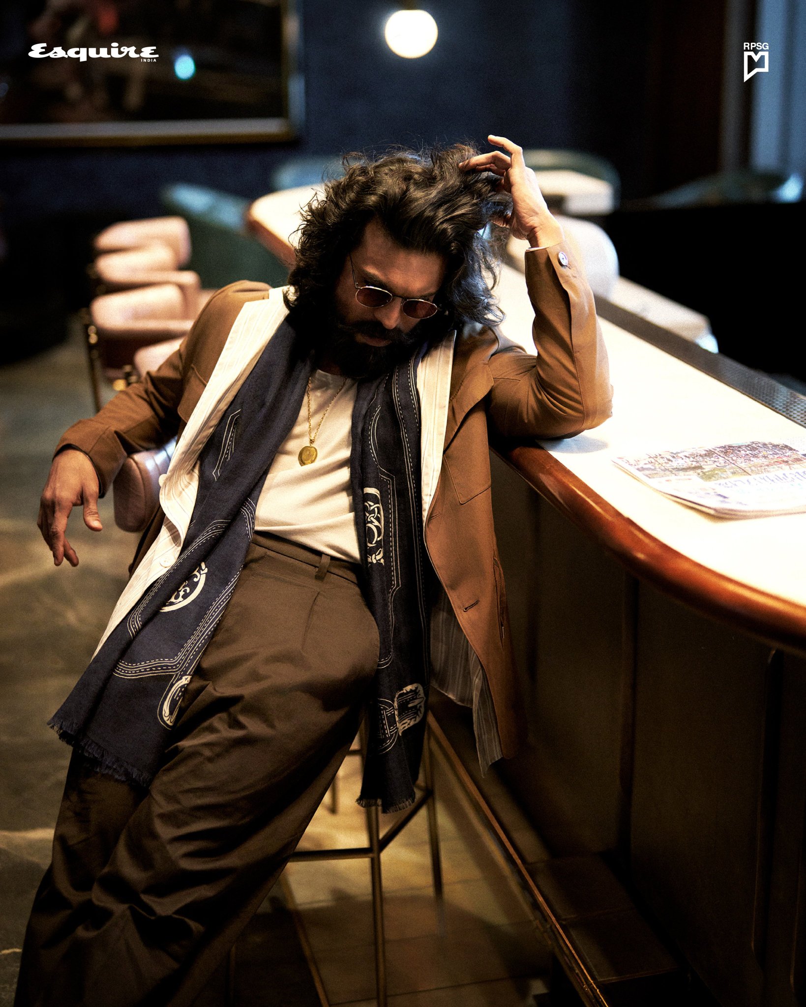 Ram Charan in a navy suit and aviators on the Esquire India April 2026 cover