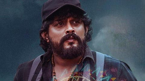 Peter Kannada Movie Review poster featuring Rajesh Dhruva in a serious look with Madikeri backdrop